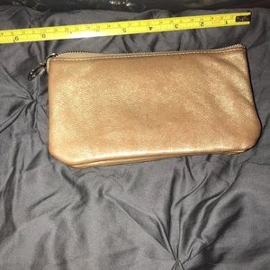 Gold toned clutch